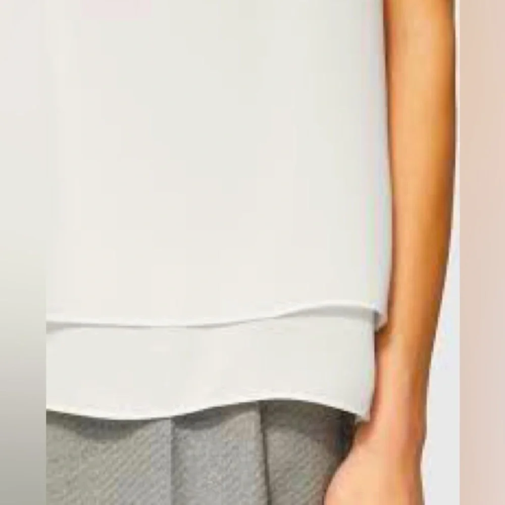 Sleeveless white blouse. Chiffon Layered bottom and longer back. Large - Picture 3 of 13